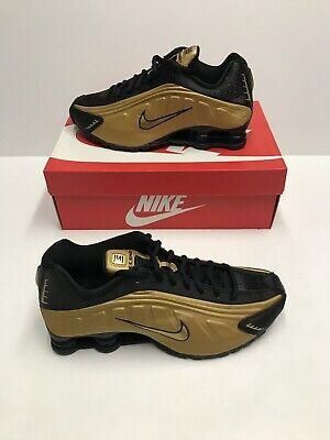 nike shox gold black